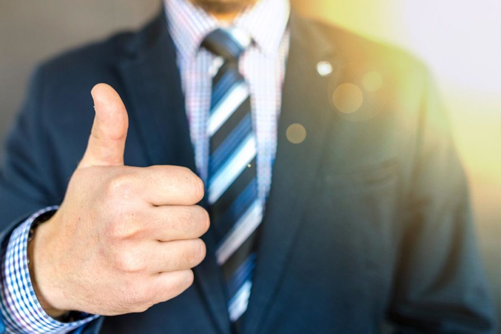 Man in suit with Thumbs Up