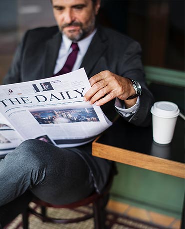 Businessman reading a newspaper