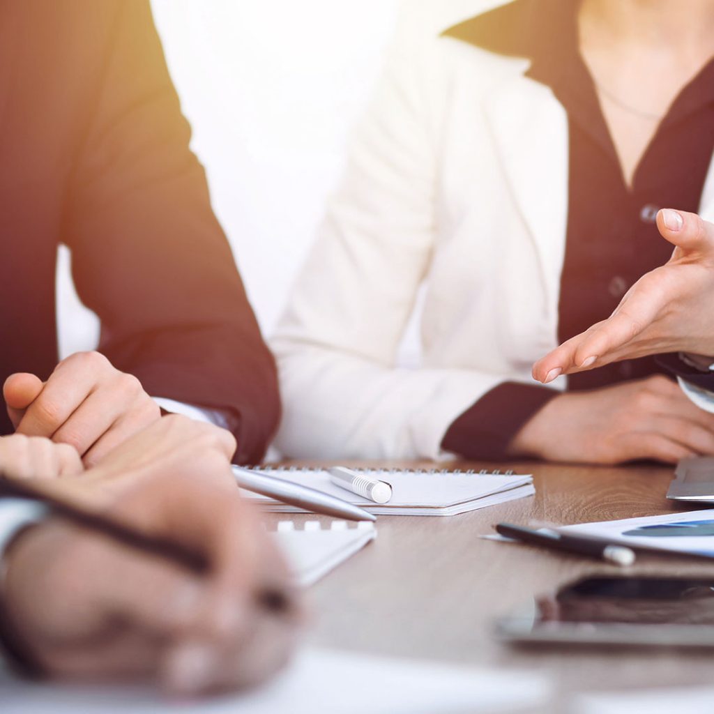 Hands at a conference table