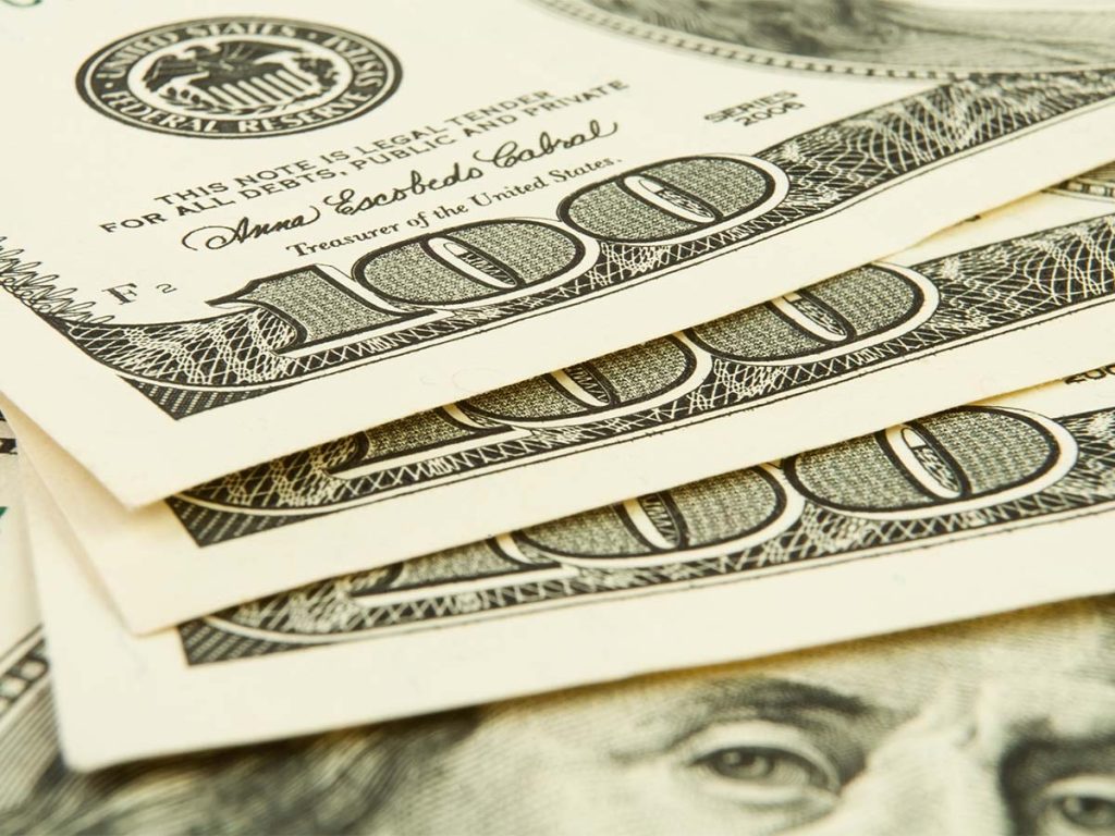 close up of stack of U.S. 100 dollar bills